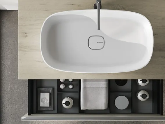 Vista zenitale del lavabo in appoggio Click in Mineralsolid Bianco Opaco su base in HPL California e cassetto con interni color antracite