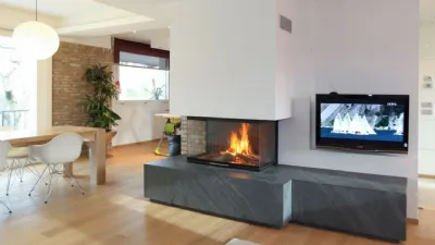 Parete attrezzata con caminetto monoblocco Spartherm a convenzione naturale, a legna di Michelin Caminetti